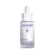 Caudalie skincare serum bottle on a light gray background