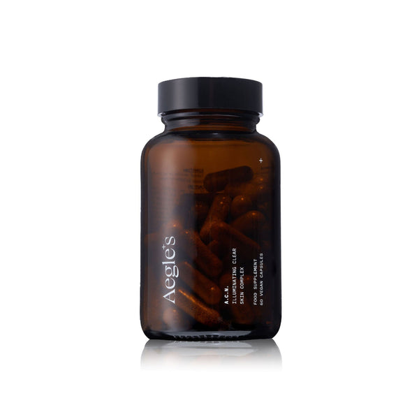 Brown supplement bottle with Aegles branding on a white background, featuring various awards.