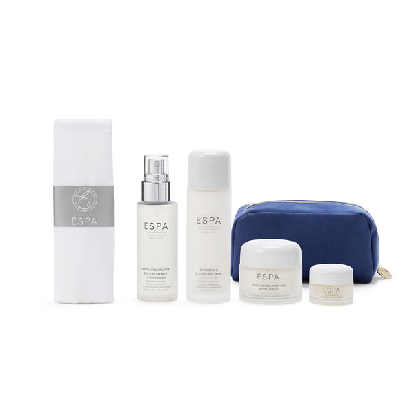 ESPA skincare products including bottles and a pouch on a white background