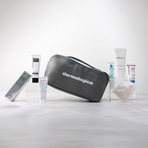 Dermalogica skincare products including a gray travel bag on a white background