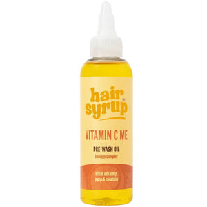 Bottle of hair syrup Vitamin C Me pre-wash oil on a white background
