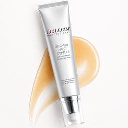 A silver tube of Collegim Professional Recovery Night Complex hair conditioner is displayed diagonally on a white background, overlaid with a curved smear of the beige-colored conditioner itself.
