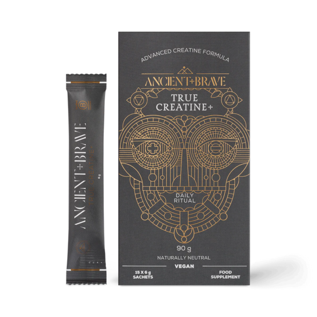 Ancient + Brave True Creatine+ vegan food supplement, showing a single black sachet packet next to its black and gold outer box packaging on a white background.