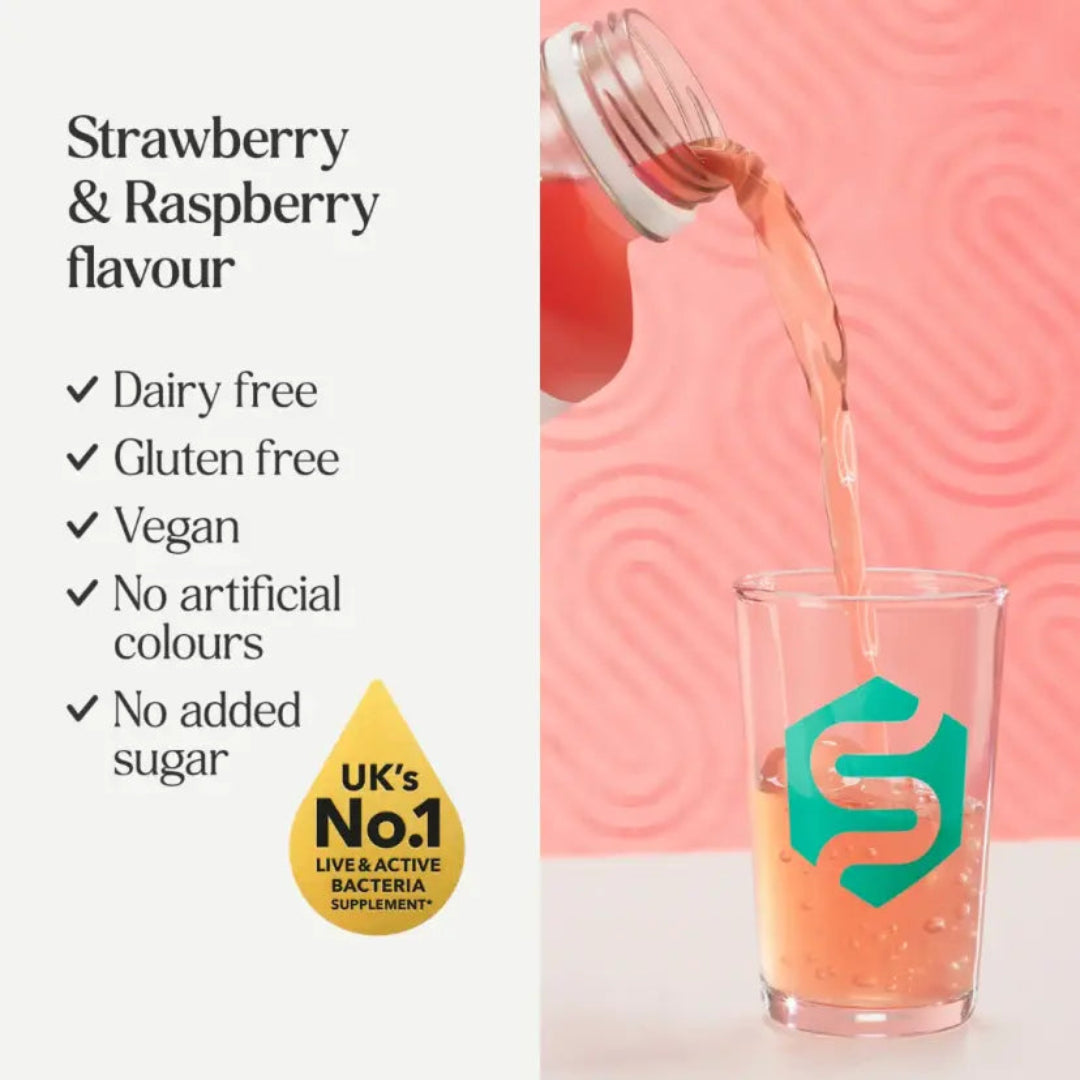 Strawberry & Raspberry flavor supplement being poured into a glass with brand logo against a pink background.
