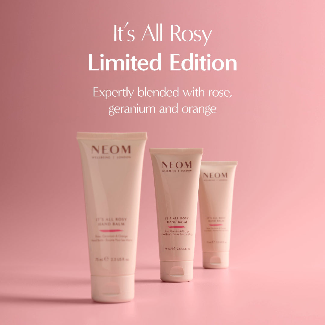 Three NEOM skincare products on a pink background with text about the 'It's All Rosy' limited edition.