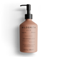Brown lotion bottle with pump and 'Wildsmith' branding on a white background