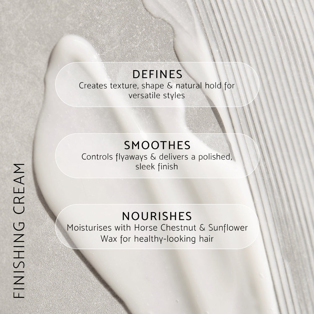 A close-up of a white cream product smear on a light gray textured background with three translucent text boxes describing benefits: Defines, Smoothes, and Nourishes. Vertical text on the left reads FINISHING CREAM.