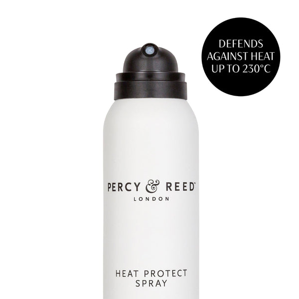 A white aerosol can of Percy & Reed London Heat Protect Spray with a black nozzle, shown on a white background with a black circular text badge that reads 'DEFENDS AGAINST HEAT UP TO 250°C'.