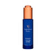 Blue bottle of Augustinus Bader face oil with a copper cap on a white background