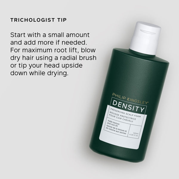 Green bottle of Philip Kingsley Density product with text on a light gray background