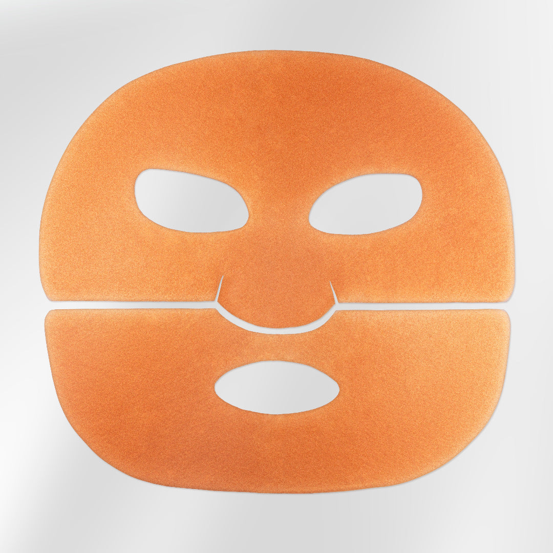 Orange face mask with cutouts on a white background