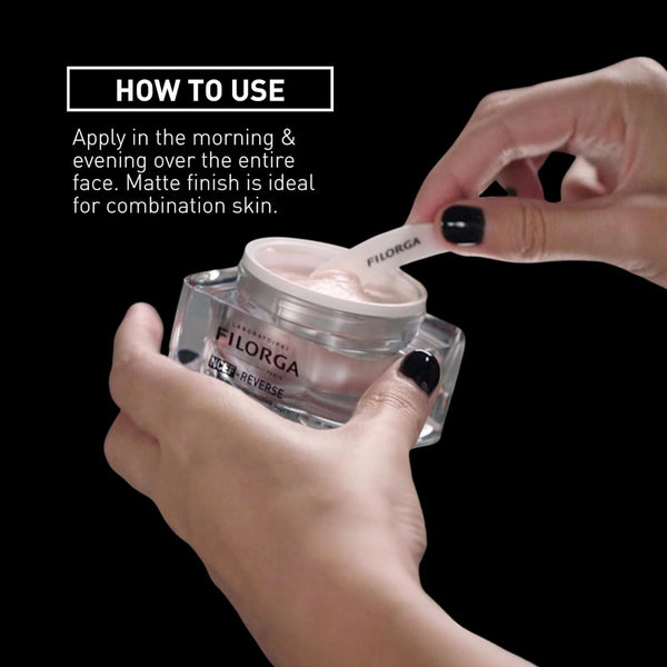 A person holds a clear cosmetic jar labeled FILORGA while applying cream from a white spatula to the lid. White text on the upper left reads 'HOW TO USE' with instructions for applying the product.