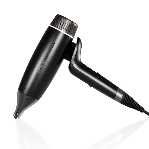 Black hair dryer with nozzle attachment on a white background