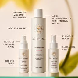 Three Innersense hair care bottles arranged on a warm beige background with callout text describing each product's benefits: a larger white bottle labeled 'I Create Volume' in the center, a smaller white pump bottle labeled 'Hair Love Hair Spray' on the left, and a small white spray bottle labeled 'I Create Fine' on the right.
