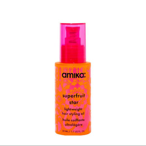 Amika Superfruit Star hair styling oil bottle on a white background
