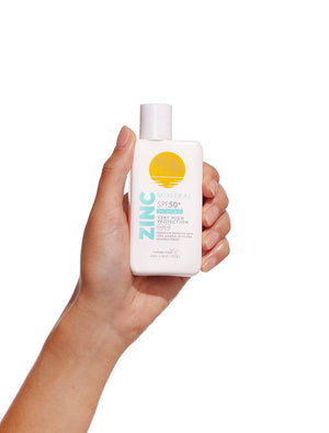 Bondi Sands Mineral Face Fluid held in a hand