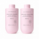 Two light pink Hairgain haircare bottles on a white background: Hydrating Shampoo and Hydrating Conditioner, both labeled REFILL and 250ml.