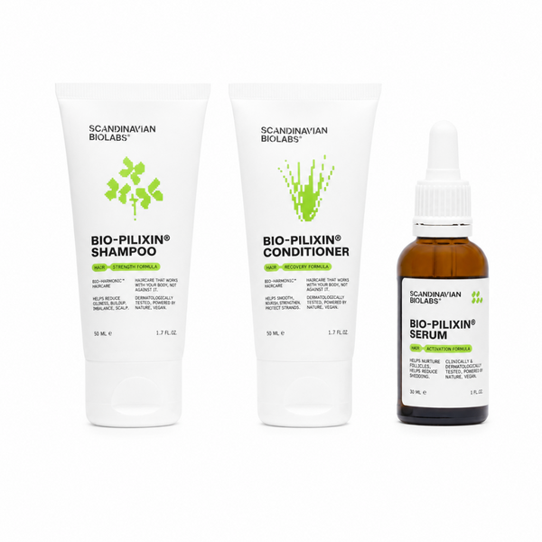 Three scalp care products from Scandinavian Bioblasts on a white background: Bio-Pilixin Shampoo, Bio-Pilixin Conditioner, and Bio-Pilixin Serum. The shampoo and conditioner are in white squeeze tubes with green leaf graphics, and the serum is in a small amber glass bottle with a white dropper cap.