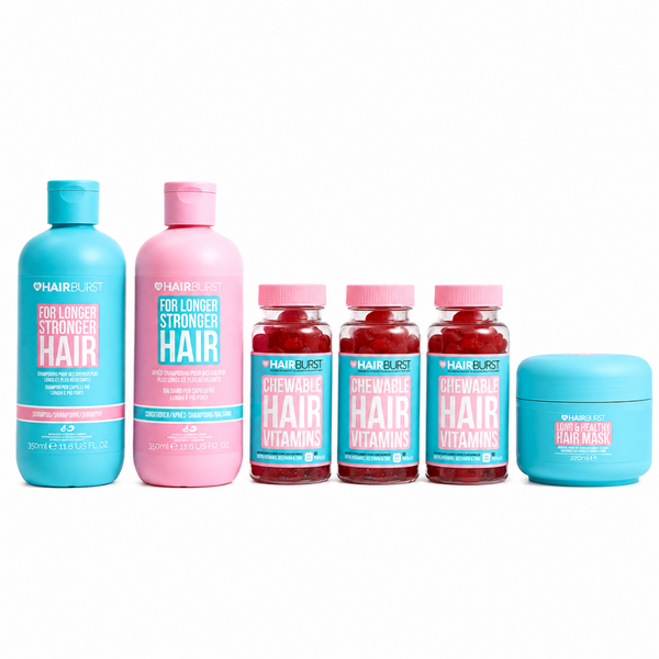 Hair Blast hair care set featuring a turquoise shampoo bottle, a pink conditioner bottle, three small bottles of chewable hair vitamins, and a turquoise hair mask jar, all arranged on a white background.