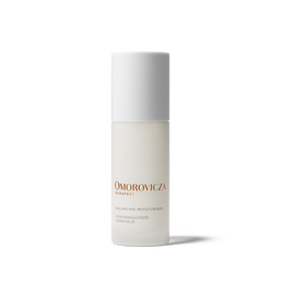 Omorovicza Skincare Balancing Moisturiser in a frosted glass bottle with a white cap, featuring gold and black text on a clean white background.