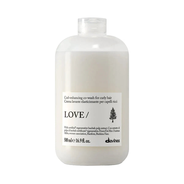 White bottle of Davines hair care product on a white background