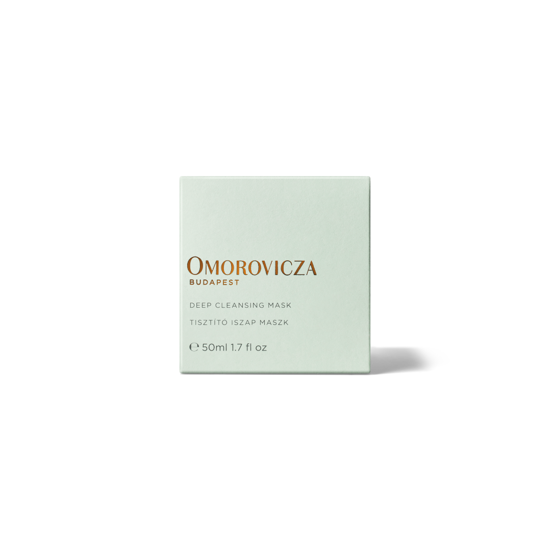 A square pale mint green box of Omorovicza Budapest Deep Cleansing Mask, featuring gold and gray text, centered on a white background with a soft shadow.