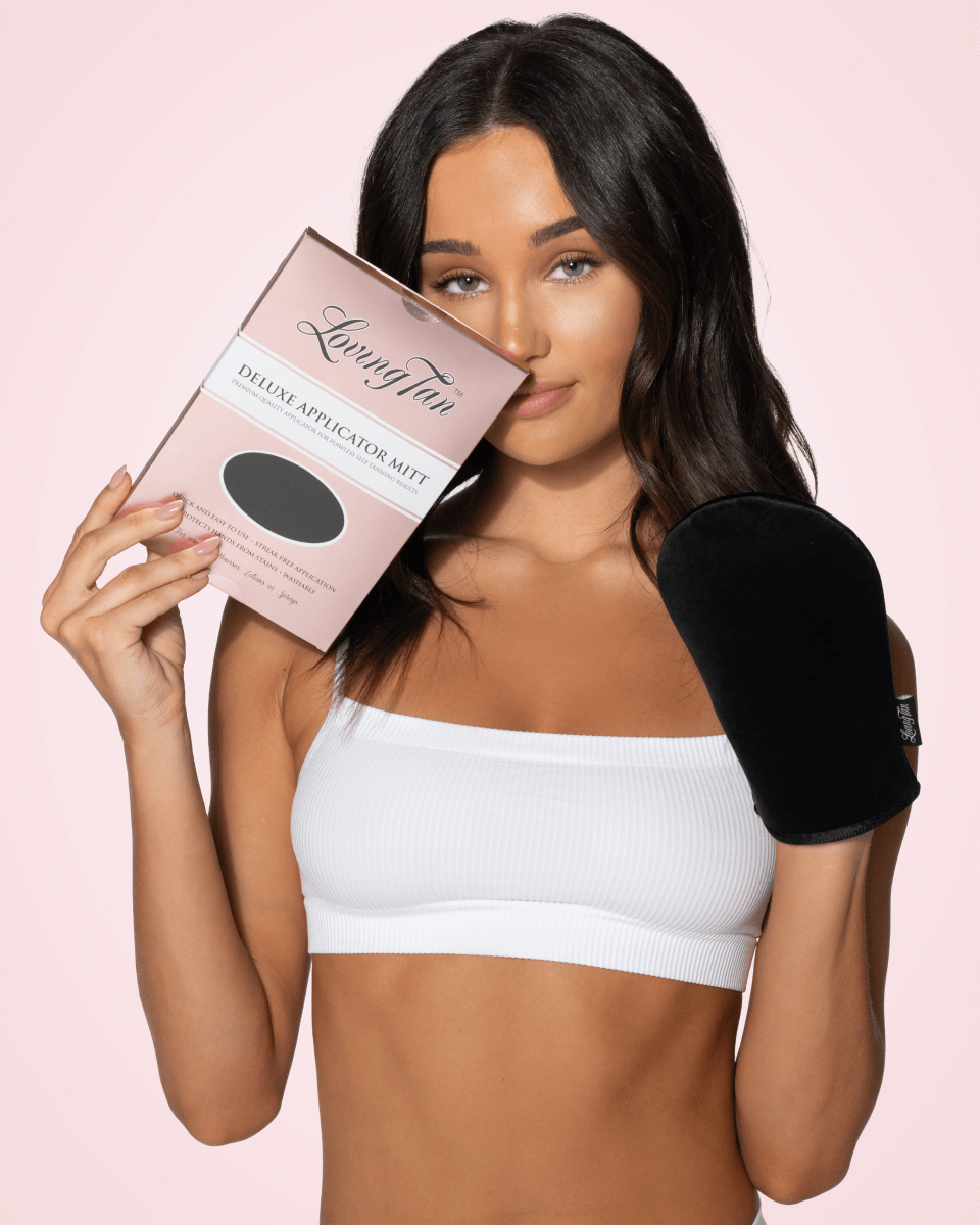 model holding a application mitt