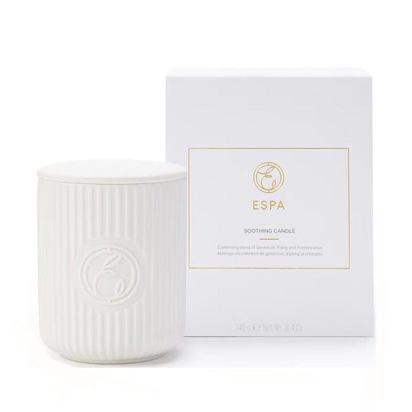 White candle with ribbed texture and matching white box featuring 'ESPA' branding on a white background.