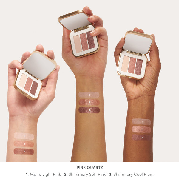 Makeup swatches on skin with a compact palette labeled 'Pink Quartz'.