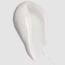 White ceramic spoon rest on a light gray background
