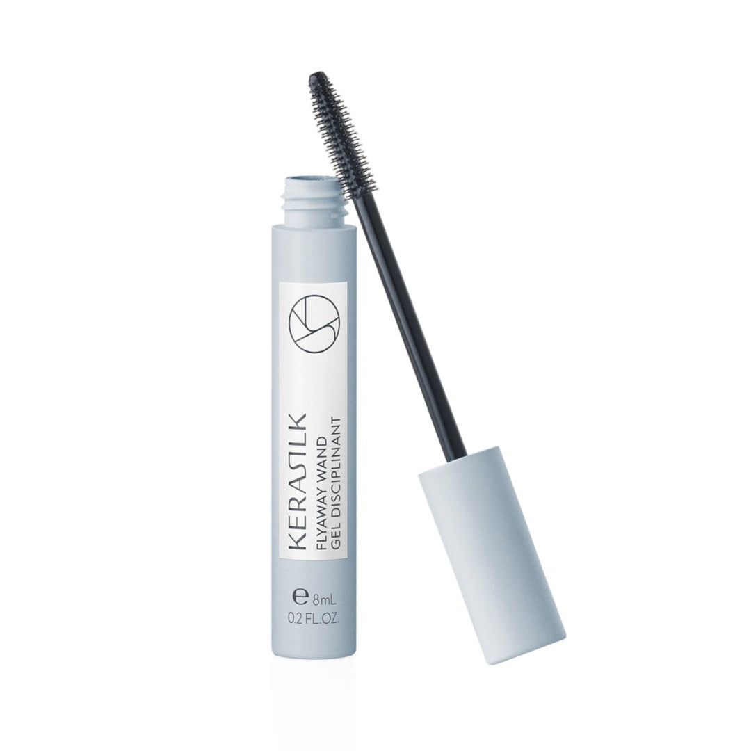Eyelash serum with applicator on a white background