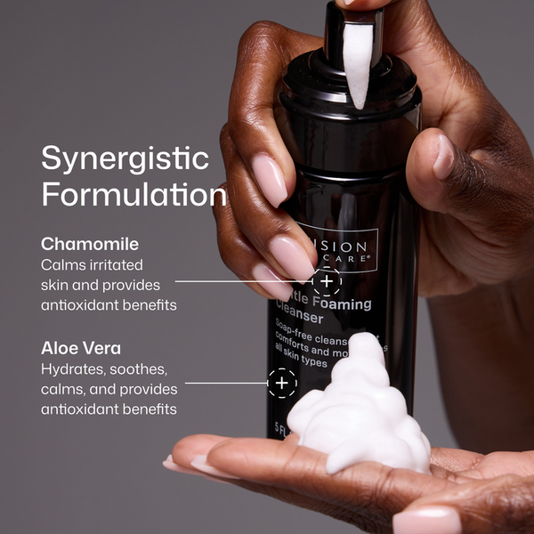 Hand holding a bottle of cleansing foam with text about synergistic formulation and ingredients.