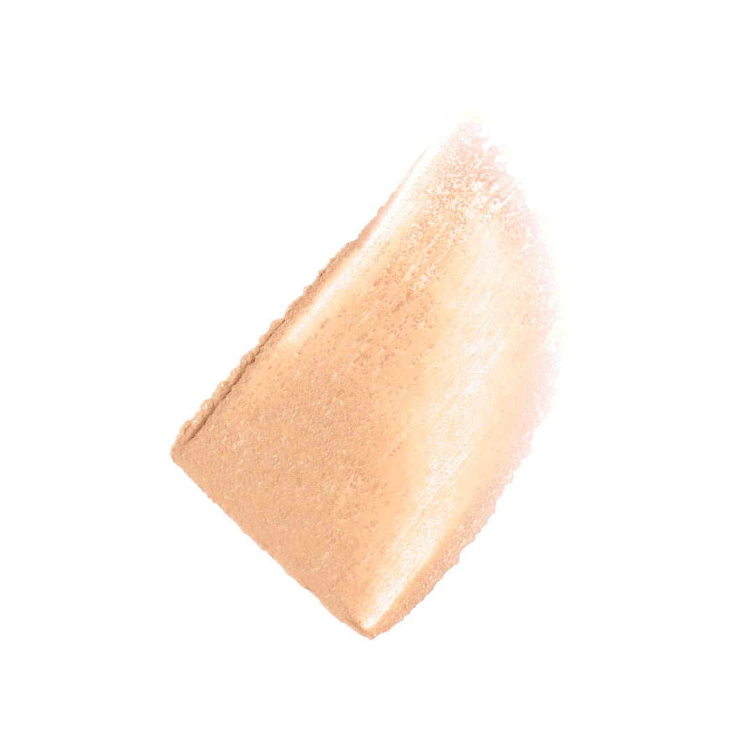 Close-up of a beige makeup swatch on a white background