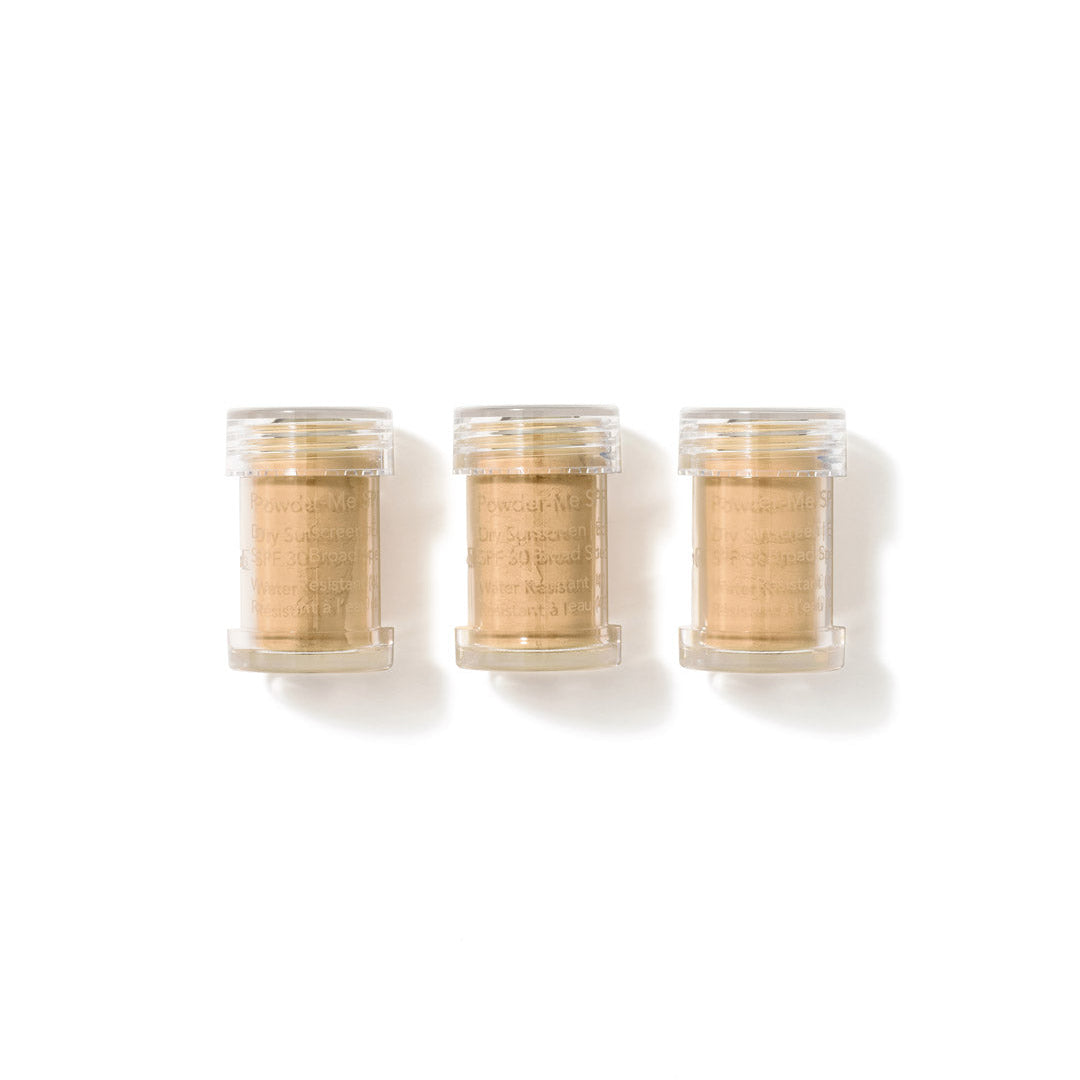 Three small clear plastic jars filled with a light tan powder, arranged side by side on a white background.