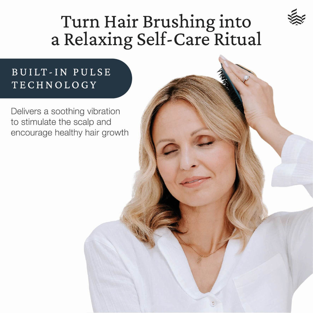 A woman with blonde hair brushes her hair with a black pulse-style hairbrush against a white background, with promotional text reading 'Turn Hair Brushing into a Relaxing Self-Care Ritual' and 'Built-In Pulse Technology'.