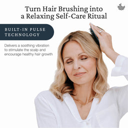 A woman with blonde hair brushes her hair with a black pulse-style hairbrush against a white background, with promotional text reading 'Turn Hair Brushing into a Relaxing Self-Care Ritual' and 'Built-In Pulse Technology'.