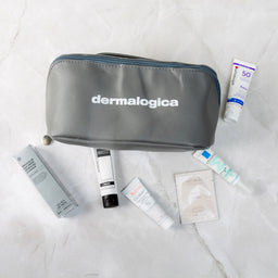 Dermalogica cosmetic bag with skincare products on a light background