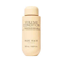Nak Hair Volume Condition bottle on a white background