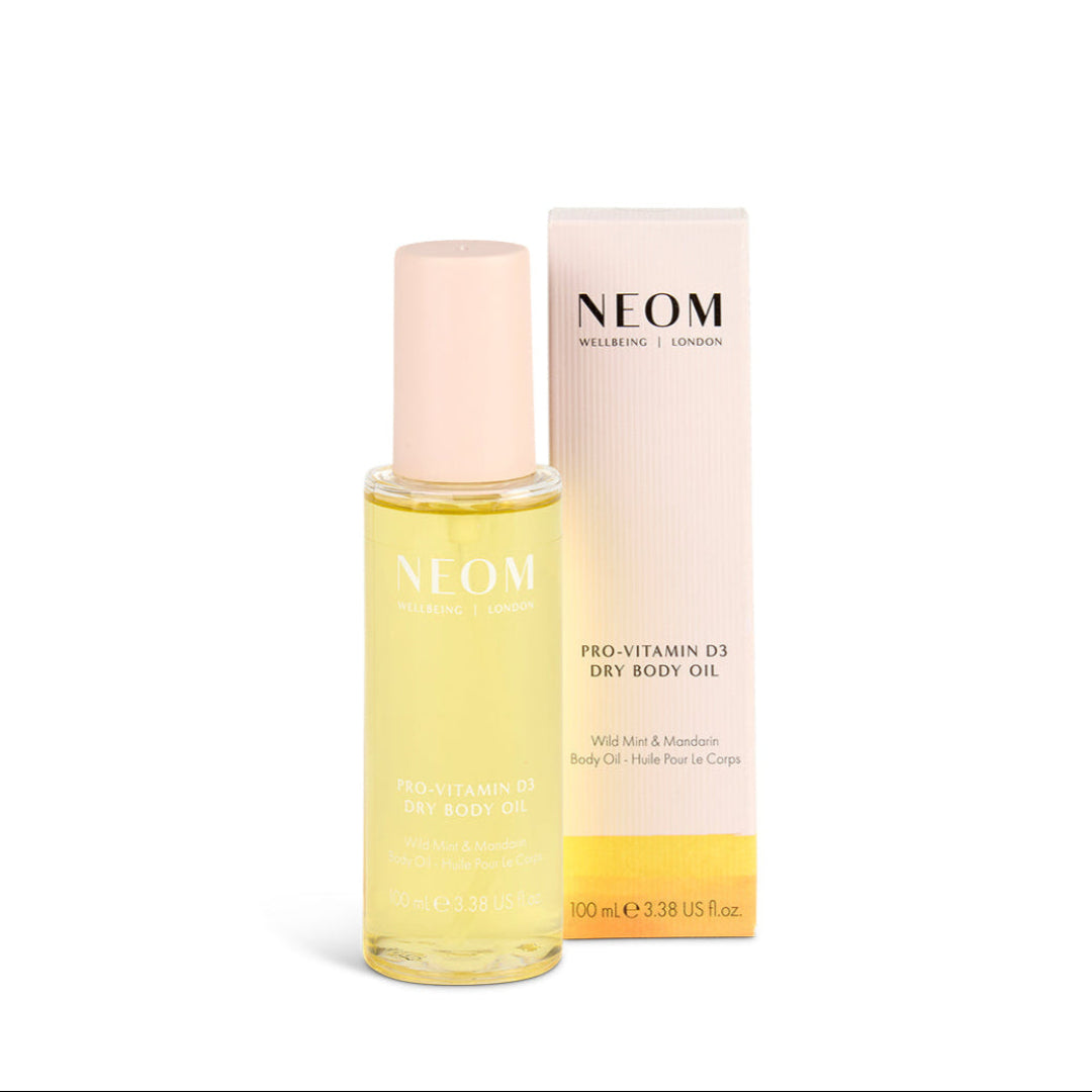 NEOM Pro-Vitamin D3 Dry Body Oil with packaging on a white background