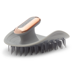 Gray grooming brush with rose gold handle on a white background