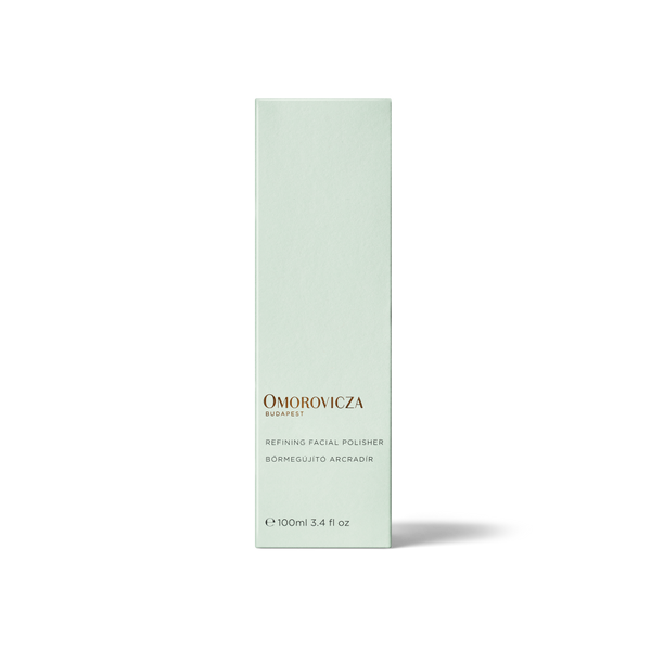 A tall, slender pale mint green box for Omorovicza Bio系列 Refining Facial Polisher, shown on a clean white background with a soft shadow.