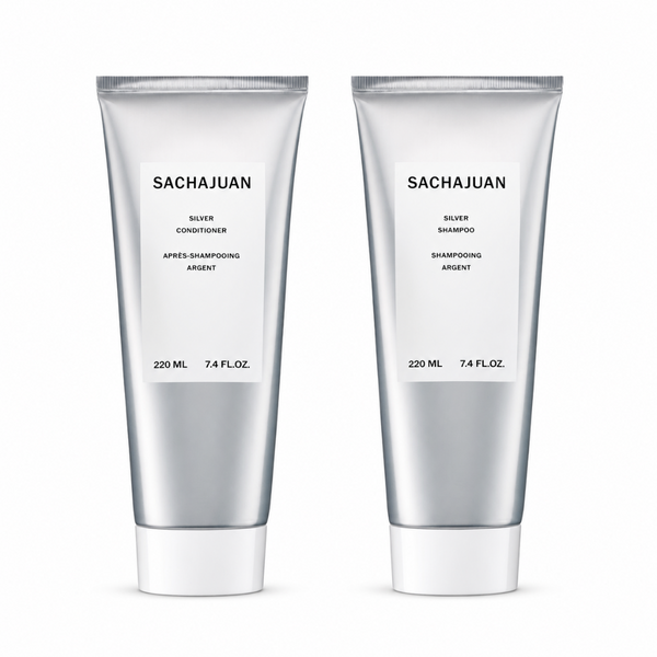 Two silver squeeze tubes of Sachajuan hair care products, labeled Silver Conditioner and Silver Shampoo, on a clean white background.