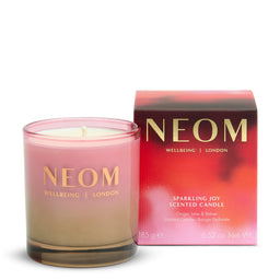 NEOM candle and packaging on a white background