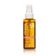 Ultrason Family Wet Skin Transparent Protection Sun Protection Spray SPF 50 in a clear bottle showing amber liquid, with a white spray top, on a white background.