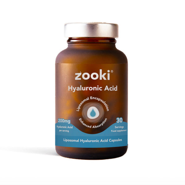 A bottle of Zooki Hyaluronic Acid liposomal capsules, featuring an amber brown bottle, a silver cap, and a blue and white label, set against a plain white background.