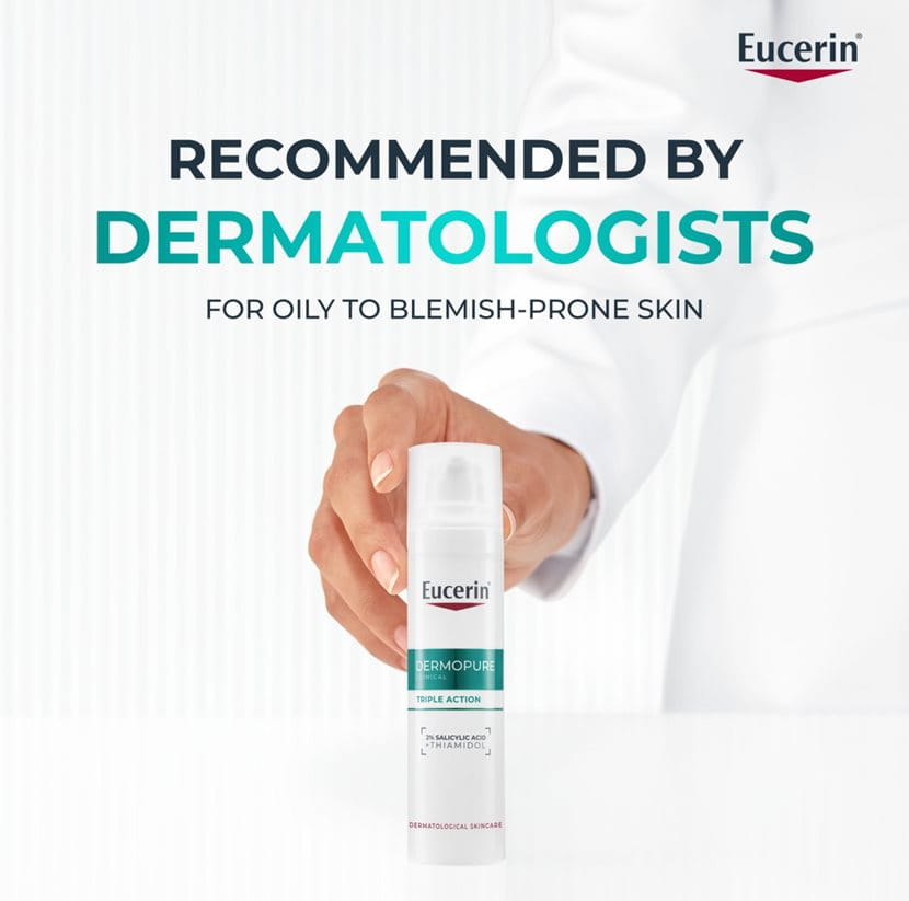 Eucerin Dermopure bottle held by a person with text about dermatologist recommendation on a white background