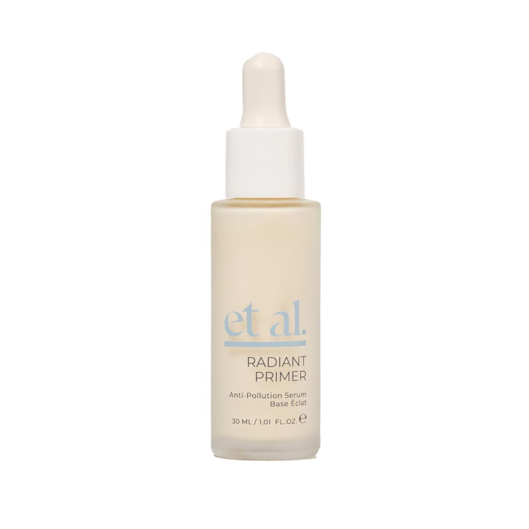 Skincare serum bottle with dropper labeled 'et al.' on a white background