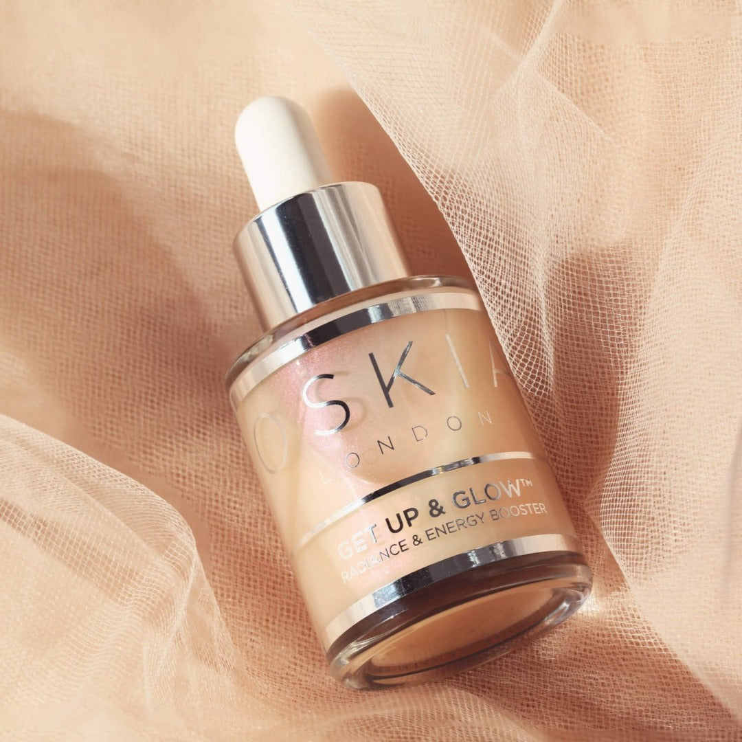 OSKIA Get Up & Glow bottle on a pink mesh