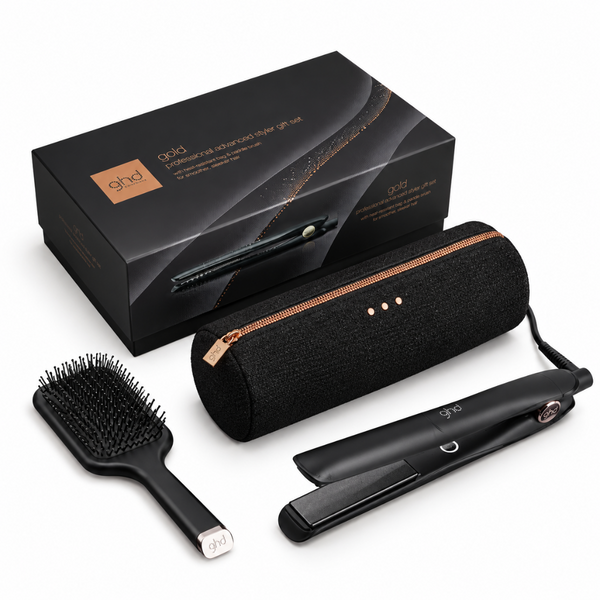 ghd Gold Professional Curling Iron set with a black hairbrush, black travel case, and black retail box on a white background.