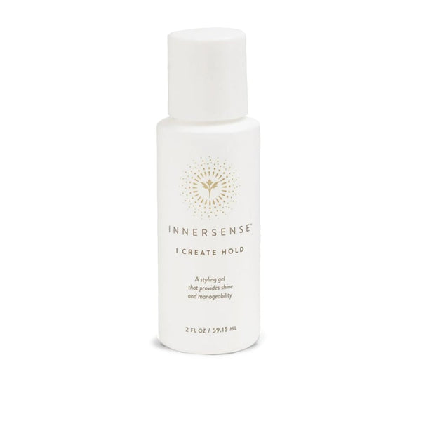 A white bottle of Innersense I Create Hold styling gel with a gold logo and text, set against a plain white background.